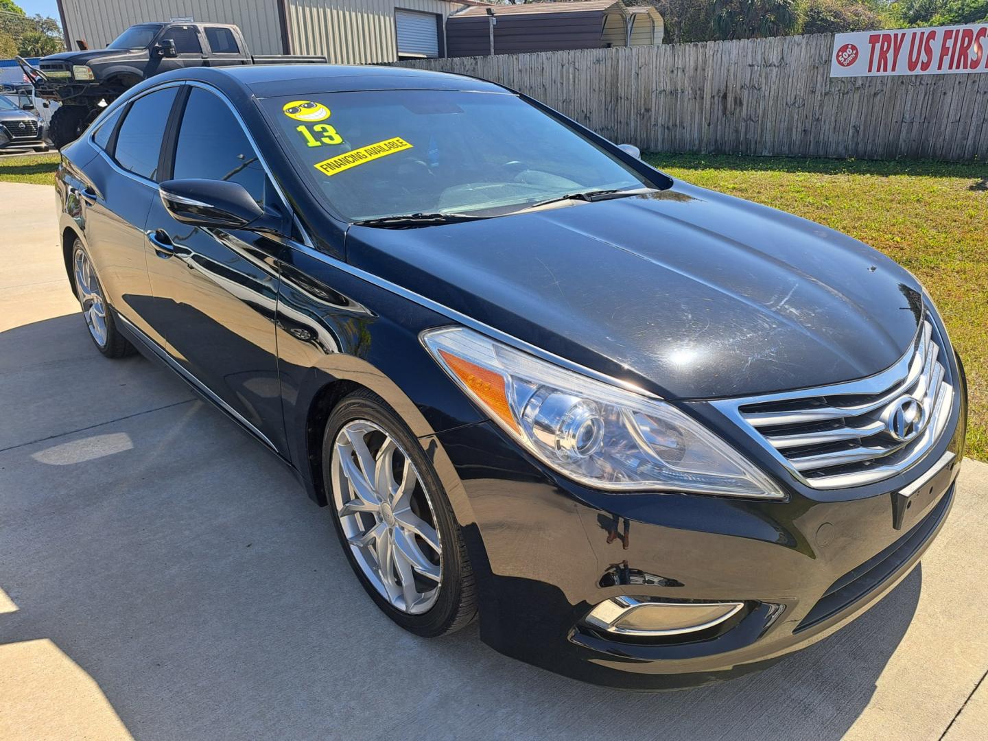 2013 Black Hyundai Azera 3.3L (KMHFH4JG0DA) with an 3.3L V6 DOHC 24V engine, 6-Speed Automatic transmission, located at 1181 Aurora Rd, Melbourne, FL, 32935, (321) 241-1100, 28.132914, -80.639175 - Photo#1